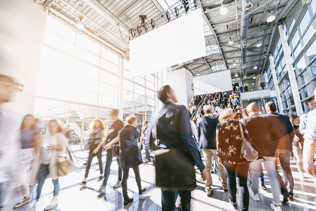 A group of people walking in a building